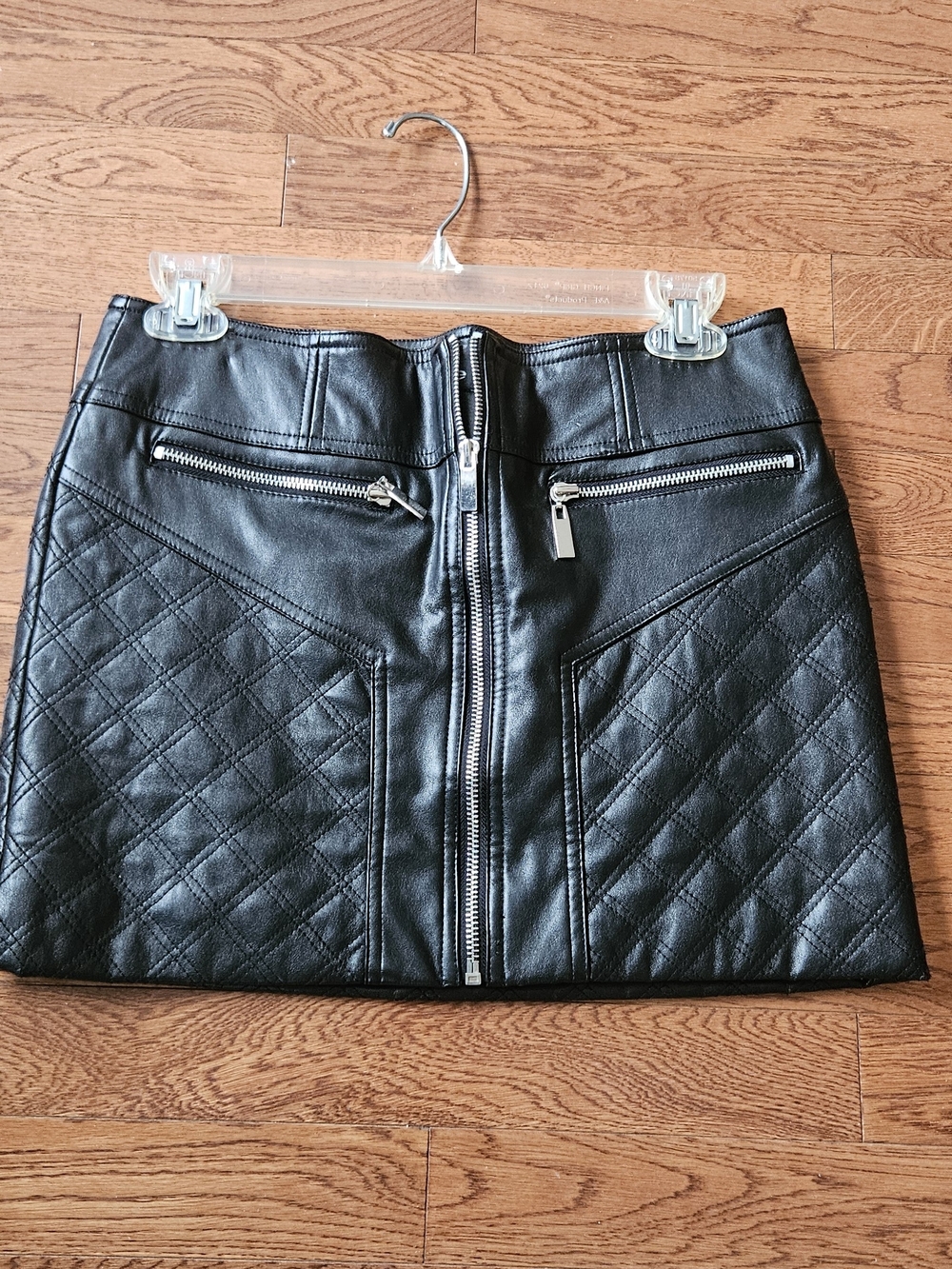bebe Black Quilted Faux Leather Mini Skirt with Front Zip Detail
